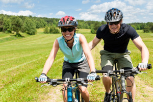 Sport mountain biking - man pushing young girl